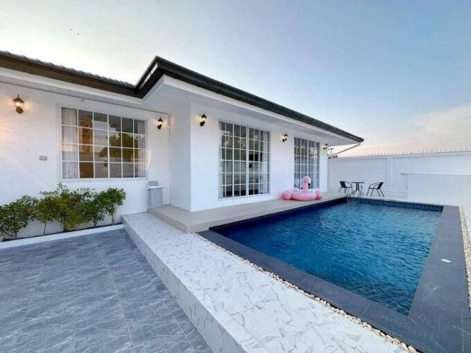 Affordable two-bedroom, two-bathroom villa in Pattaya featuring a spacious swimming pool, 56 sq.wah