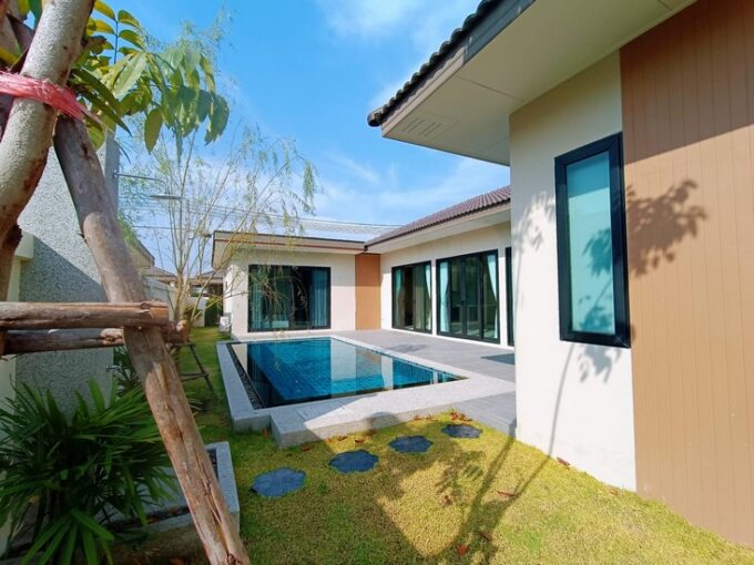 Contemporary pool villa in Pattaya featuring integrated luxury furnishings within a tranquil and secure development